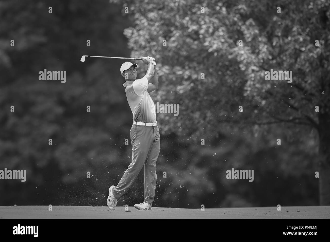 Potomac MD, USA. 28th June, 2018. A black and white photo of Tiger Woods (USA) hits his second shot from the center of the fairway at the second hole during the opening round at the 2018 Quicken Loans National at the Tournament Players Club in Potomac MD. Credit: Cal Sport Media/Alamy Live News Stock Photo