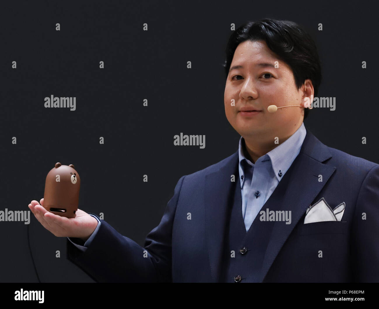 Urayasu, Japan. 28th June, 2018. Japan's SNS giant LINE chief strategy officer Jun Masuda displays the company's smart speaker 'Clova Friends mini' at the LINE conference 2018 in Urayasu, suburban Tokyo on Thursday, June 28, 2018. LINE announced the new service of 'Clova Auto', a system linking LINE's smart speaker Clova and automobiles of Toyota Motor Corporation to provide in-vehicle voice operation services. Credit: Yoshio Tsunoda/AFLO/Alamy Live News Stock Photo
