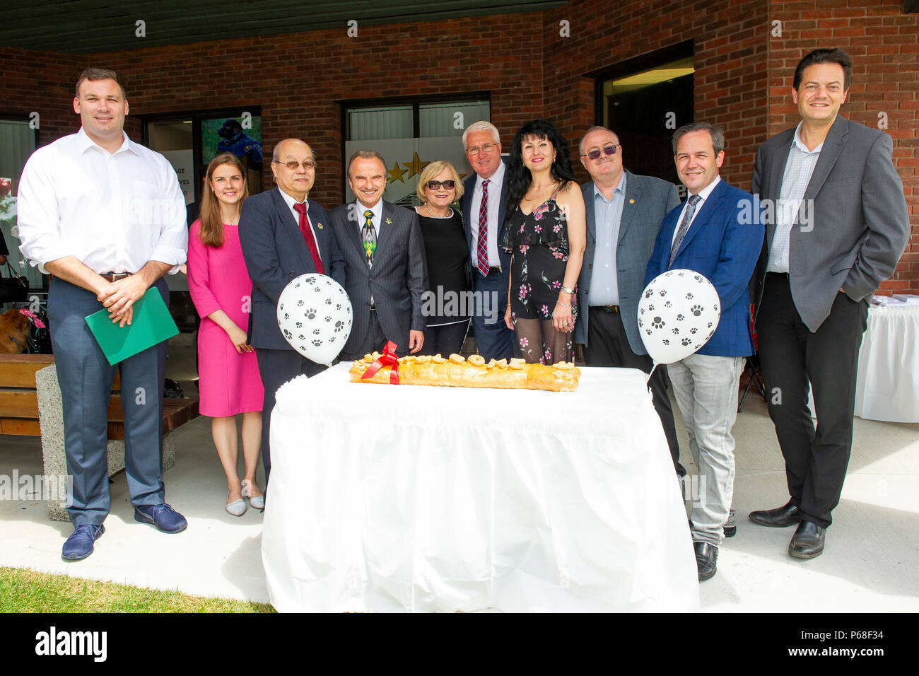 Barrie, Ontario, Canada. 28th June 2018. Elected officials from Federal - MP John Brassard and MP Alex Nuttall, Provincial - MPP Andrea Khanjin and MPP Doug Downey, and City of Barrie - Mayor Jeff Lehman joined together in welcoming and celebrating the grand opening of HomeLife All Points Realty Inc., Brokerage office in Barrie with franchise owner Julia Stanford, Broker of Record, and Robert Stanford and HomeLife Realty Services founder Andrew Cimerman. Credit: EXImages/Alamy Live News Stock Photo