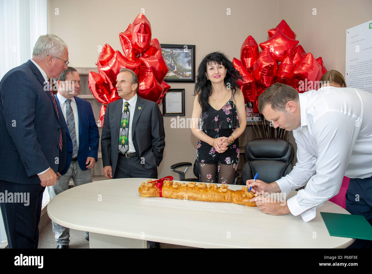 Barrie, Ontario, Canada. 28th June 2018. Elected officials from Federal - MP John Brassard and MP Alex Nuttall, Provincial - MPP Andrea Khanjin and MPP Doug Downey, and City of Barrie - Mayor Jeff Lehman joined together in welcoming and celebrating the grand opening of HomeLife All Points Realty Inc., Brokerage office in Barrie with franchise owner Julia Stanford, Broker of Record, and Robert Stanford and HomeLife Realty Services founder Andrew Cimerman. Credit: EXImages/Alamy Live News Stock Photo