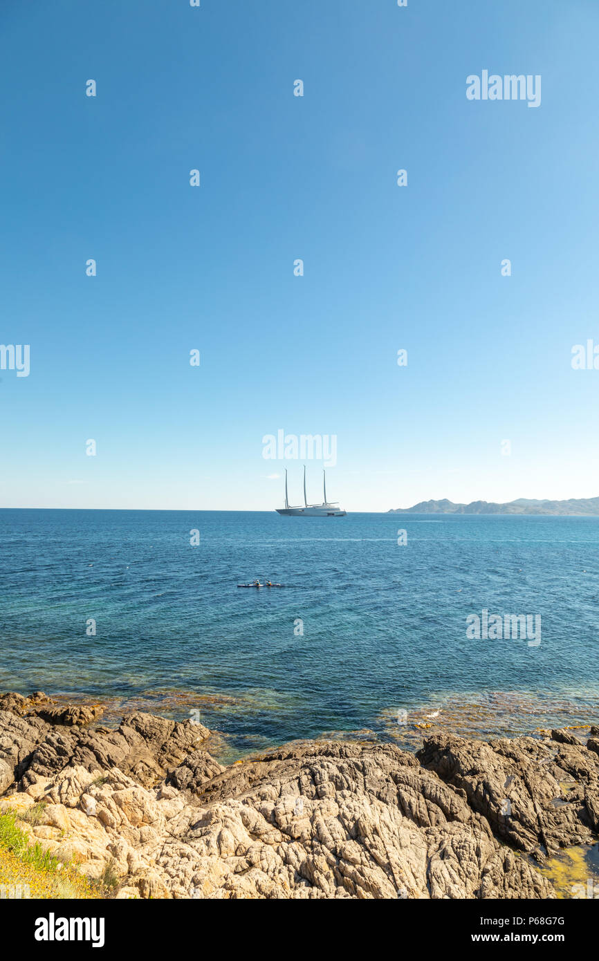 Losari Beach, Corsica. 29th Jun 2018. A double kayak paddles in front of the world’s most expensive private yacht “A” moored at Losari beach in the Balagne region of Corsica. Credit: Jon Ingall/Alamy Live News Stock Photo