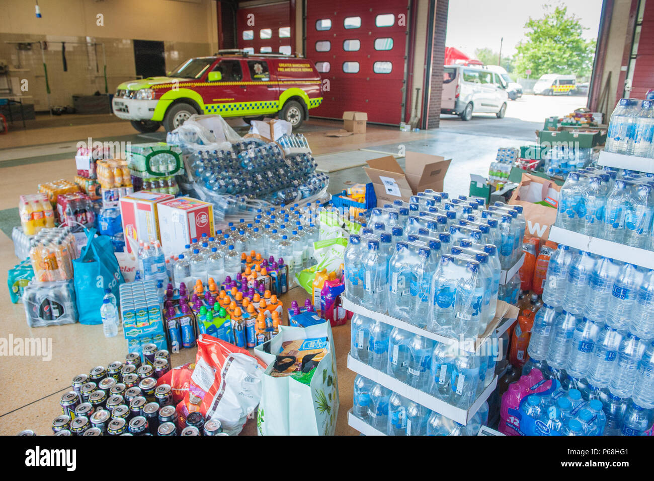 Stalybridge Fire Station, Greater Manchester, UK. 29th June, 2018. Supplies including water and food given by the public and local businesses for the needs of firefighters tackling the huge blaze on Saddleworth Moor, at Stalybridge Fire Station, Greater Manchester on Friday 29th June 2018. Credit: Matthew Wilkinson/Alamy Live News Stock Photo