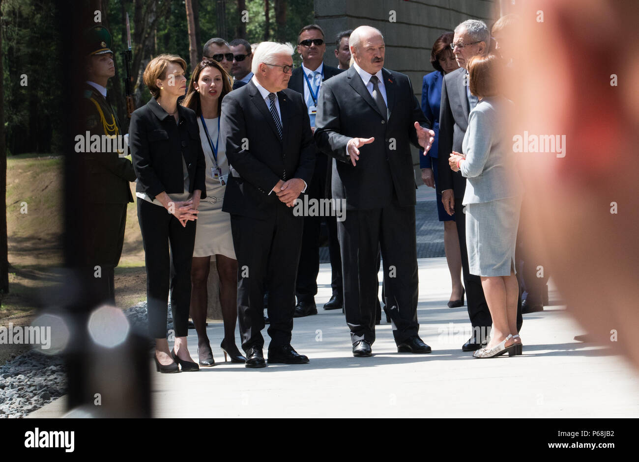 Minsk, Germany. 29th June, 2018. Elke Buedenbender (L-R), German President Frank-Walter Steinmeier of the Social Democratic Party (SPD), President of Belarus Alexandr Lukaschenko, and Austria's President Alexander Van der Bellen arrive for the inauguration of the memorial site Malyj Trostenez. Malyj Trostenez was the largest National Socialist extermination camp on the grounds of the former Sovier Union. However, like many other areas on the former Soviet Union, it is not well-known in Germany and Europe. Credit: Jörg Carstensen/dpa/Alamy Live News Stock Photo