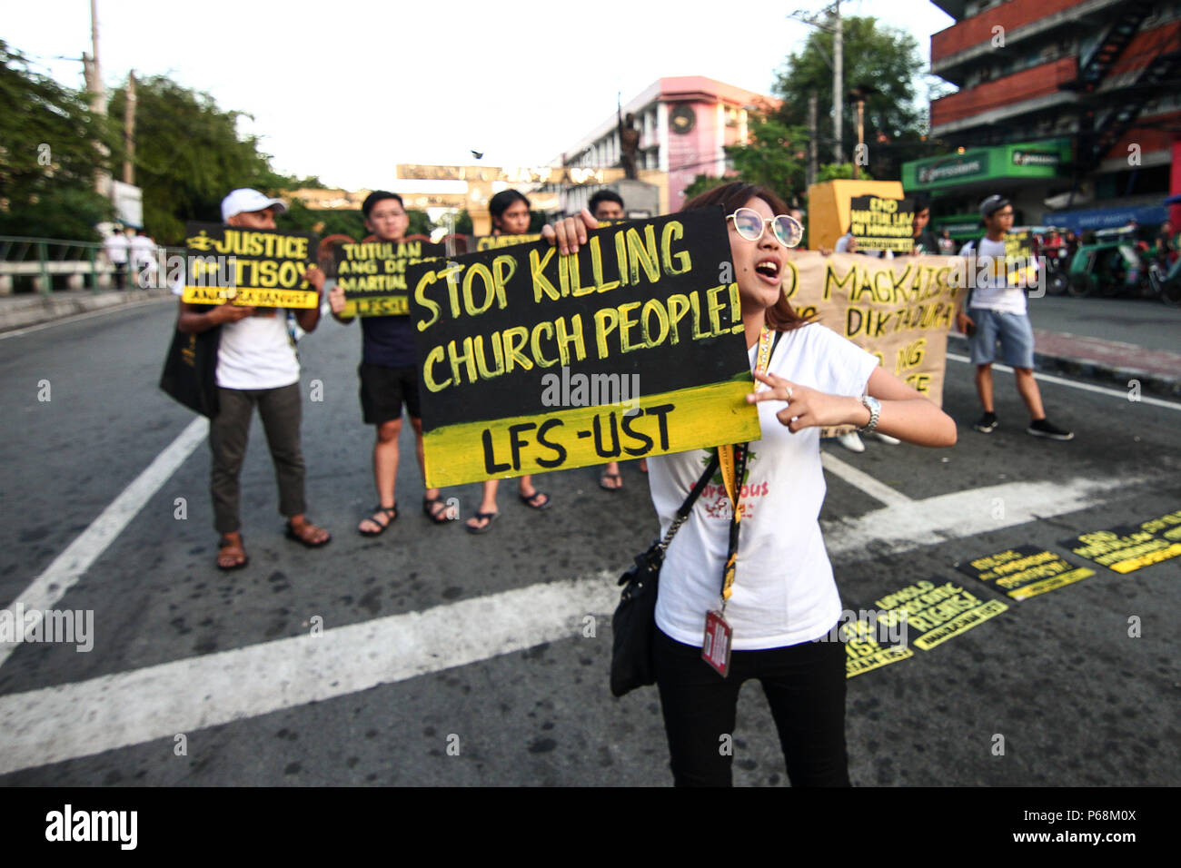 Manila, Philippines. 29th June, 2018. Students from the University of Santo Thomas staged a lightning rally near the presidential palace in Mendiola, Friday afternoon, against the recent deaths of Catholic priests. Part of the nationwide Black Friday protests, the students called for justice for Genesis ''Tisoy'' Argoncillo's death while in police detention for loitering. The group also called for the end of the Martial Law in Mindanao. Credit: J Gerard Seguia/ZUMA Wire/Alamy Live News Stock Photo