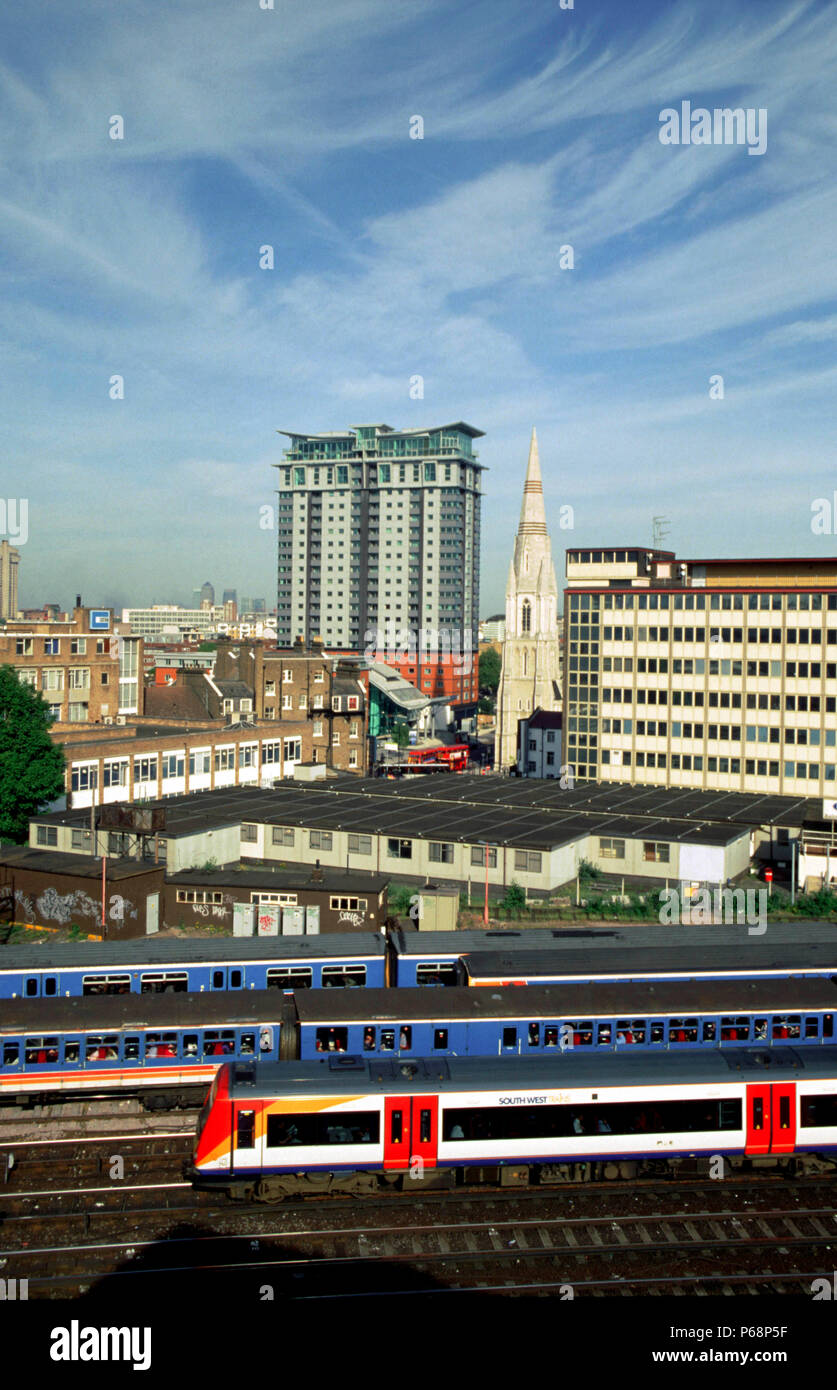 The rear of one of SWT's new Turbostar Class 170 heads through the urban landscape of South London as it departs from Waterloo. Stock Photo