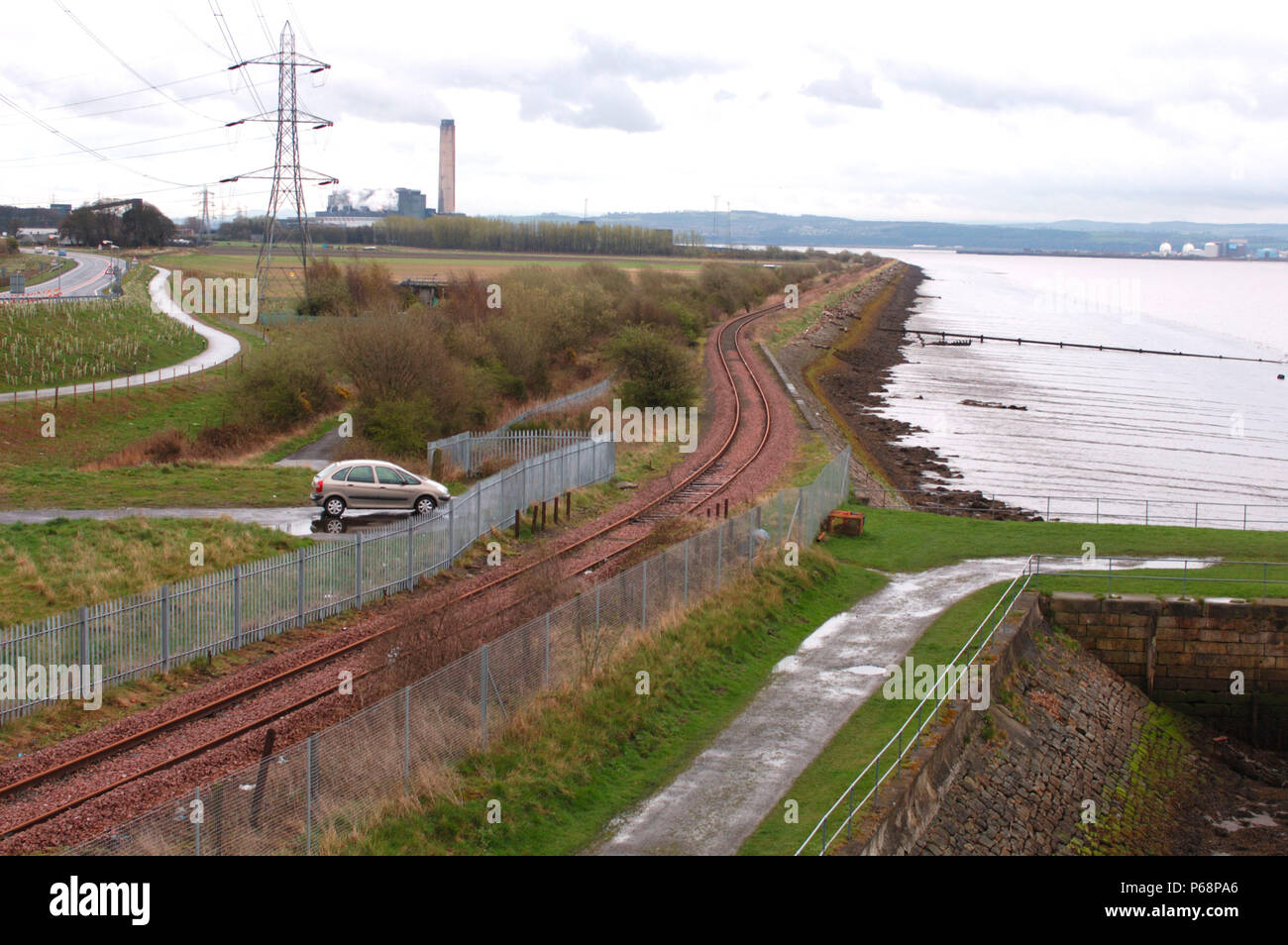 The Stirling to Alloa disused branch line in Scotland. View from road bridge looking to