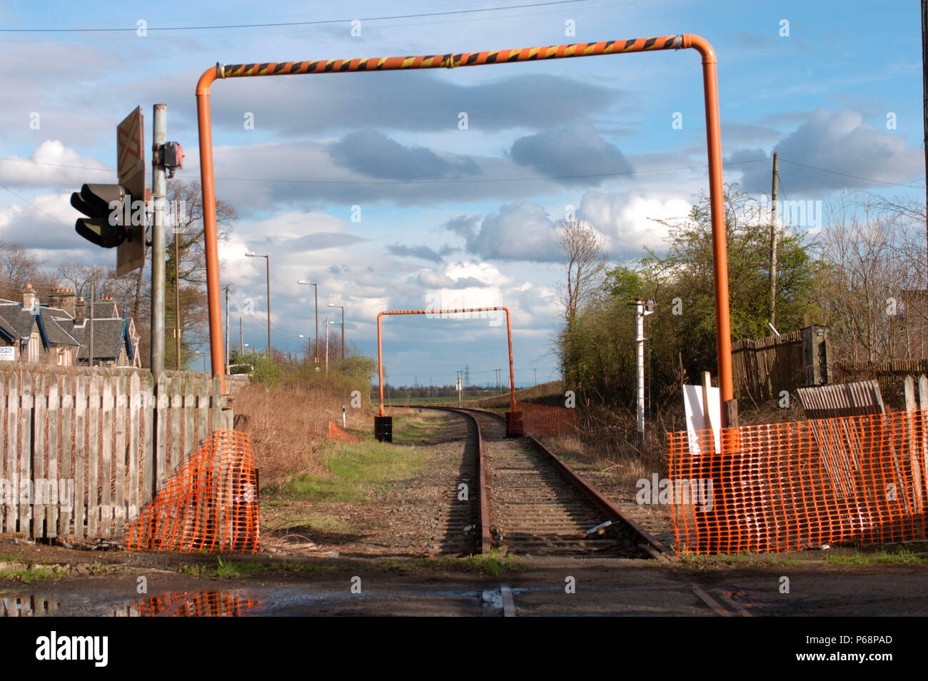 The Stirling to Alloa disused branch line in Scotland. View from crossing looking to Alloa