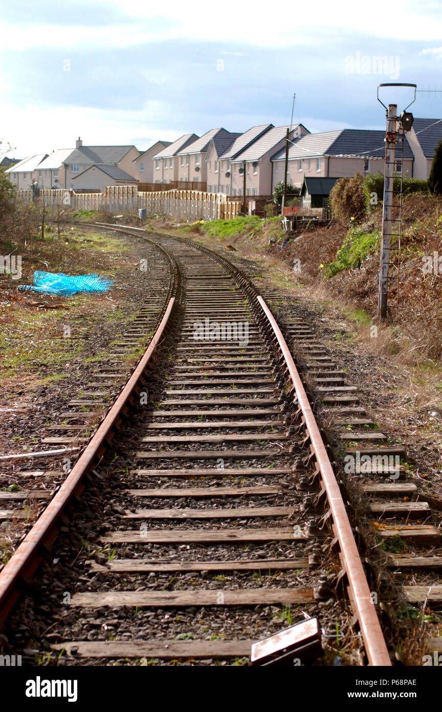 The Stirling to Alloa disused branch line in Scotland. View from crossing looking to Stirling
