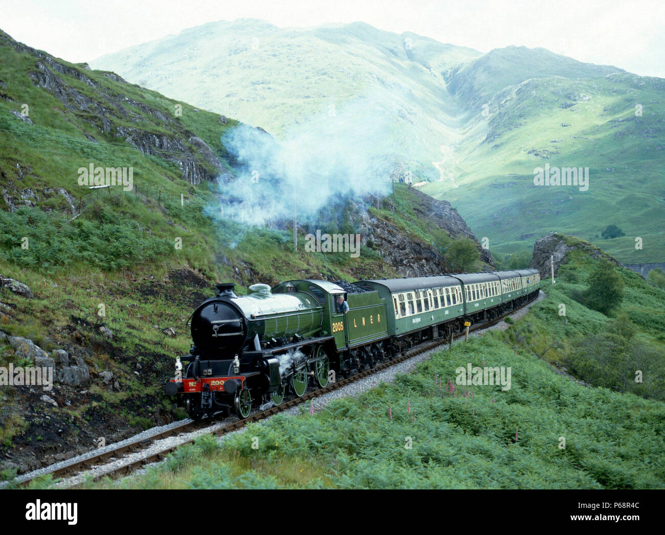 West Highlander.  No. 2005 approaches Glenfinnan after crossing the viaduct en route from Fort William to Mailaig. 28.06.1987. Stock Photo