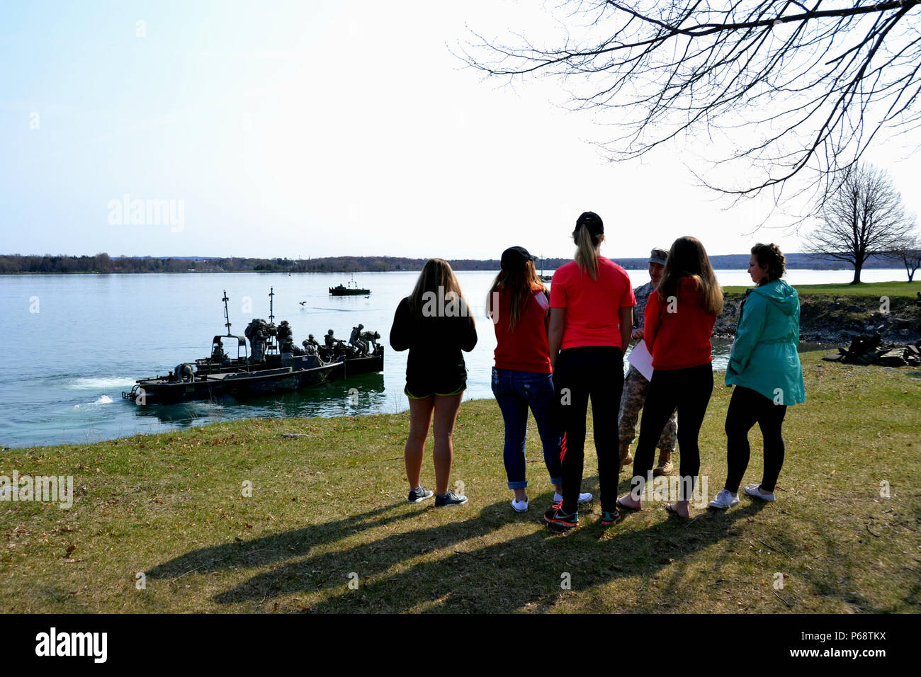 Pfc. Anthony Suriano, a member of the Sault Ste. Marie-based, 1437th Multi-Role Bridge Company, Michigan Army National Guard, explains the process for building a float bridge to students from Sault Area High School during the unit's 'Spend A Day With The Guard' event, May 6, 2016. (Michigan National Guard photo by Angela Simpson/Released) Stock Photo