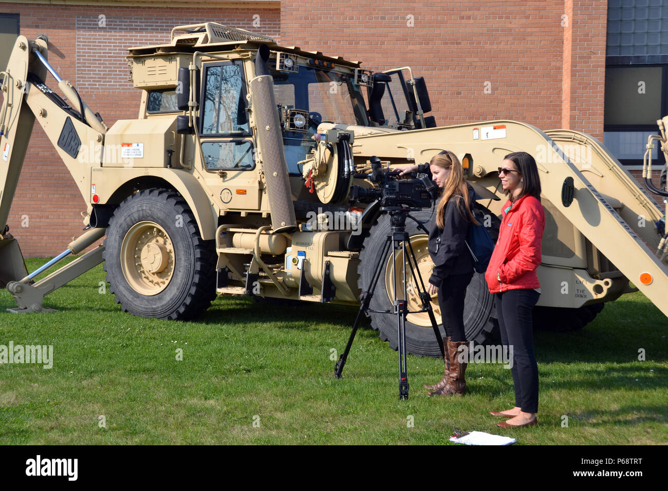 A news crew from WWTV, channels 9 and 10 in Northern Michigan films high school students interacting with members of the Sault Ste. Marie-based, 1437th Multi-Role Bridge Company, Michigan Army National Guard, May 6, 2016, during the unit's 'Spend A Day With The Guard' event. (Michigan National Guard photo by Angela Simpson/Released) Stock Photo