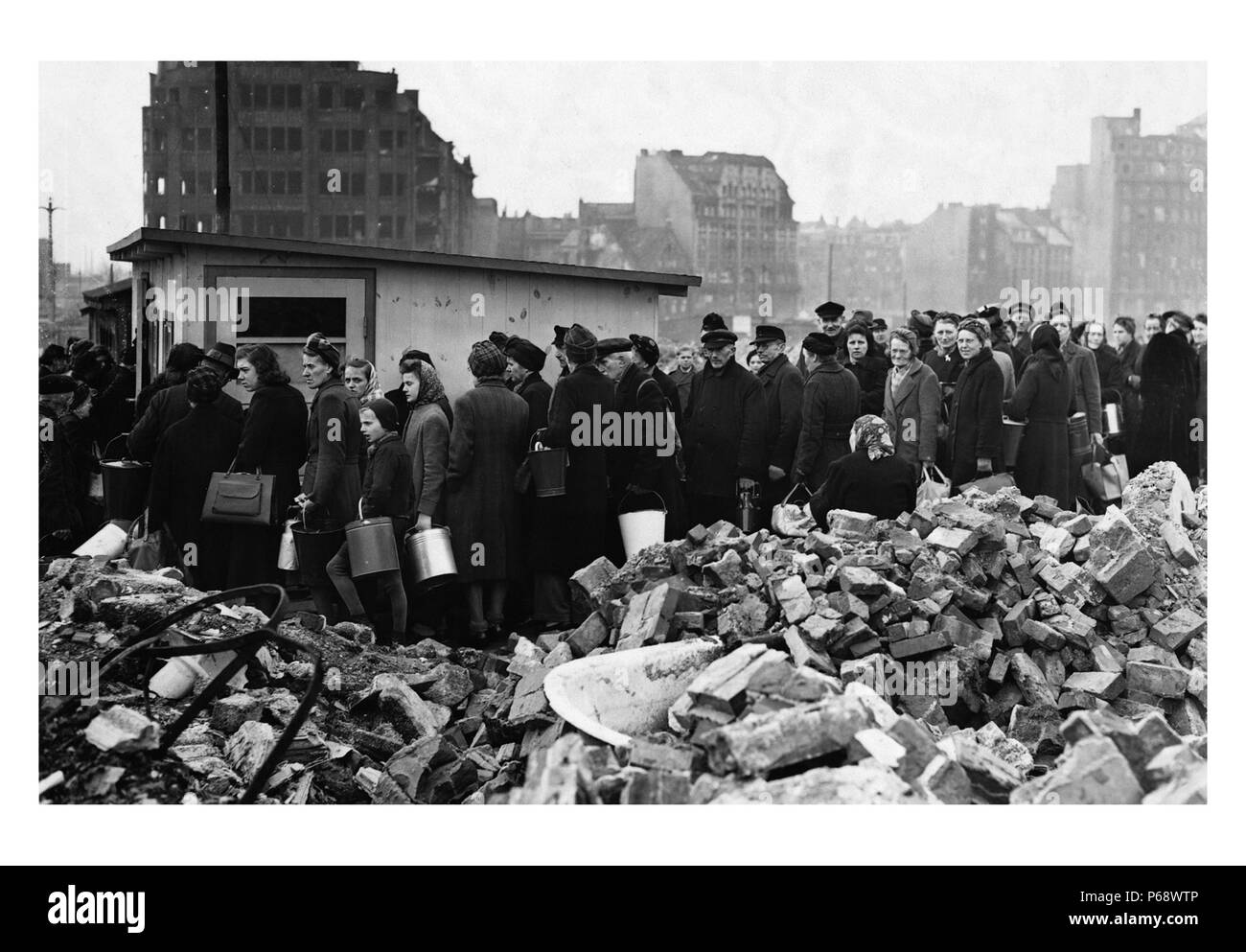 Hungry crowd of people, in the city of Hamburg; Germany March 26, 1946 during the aftermath of World war Two Stock Photo