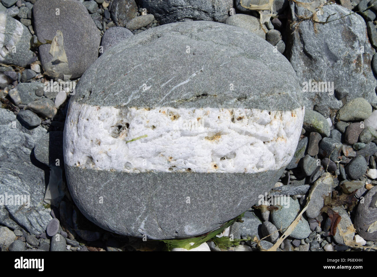 quartz veins in rock on a beach, west cork, Ireland. Stock Photo
