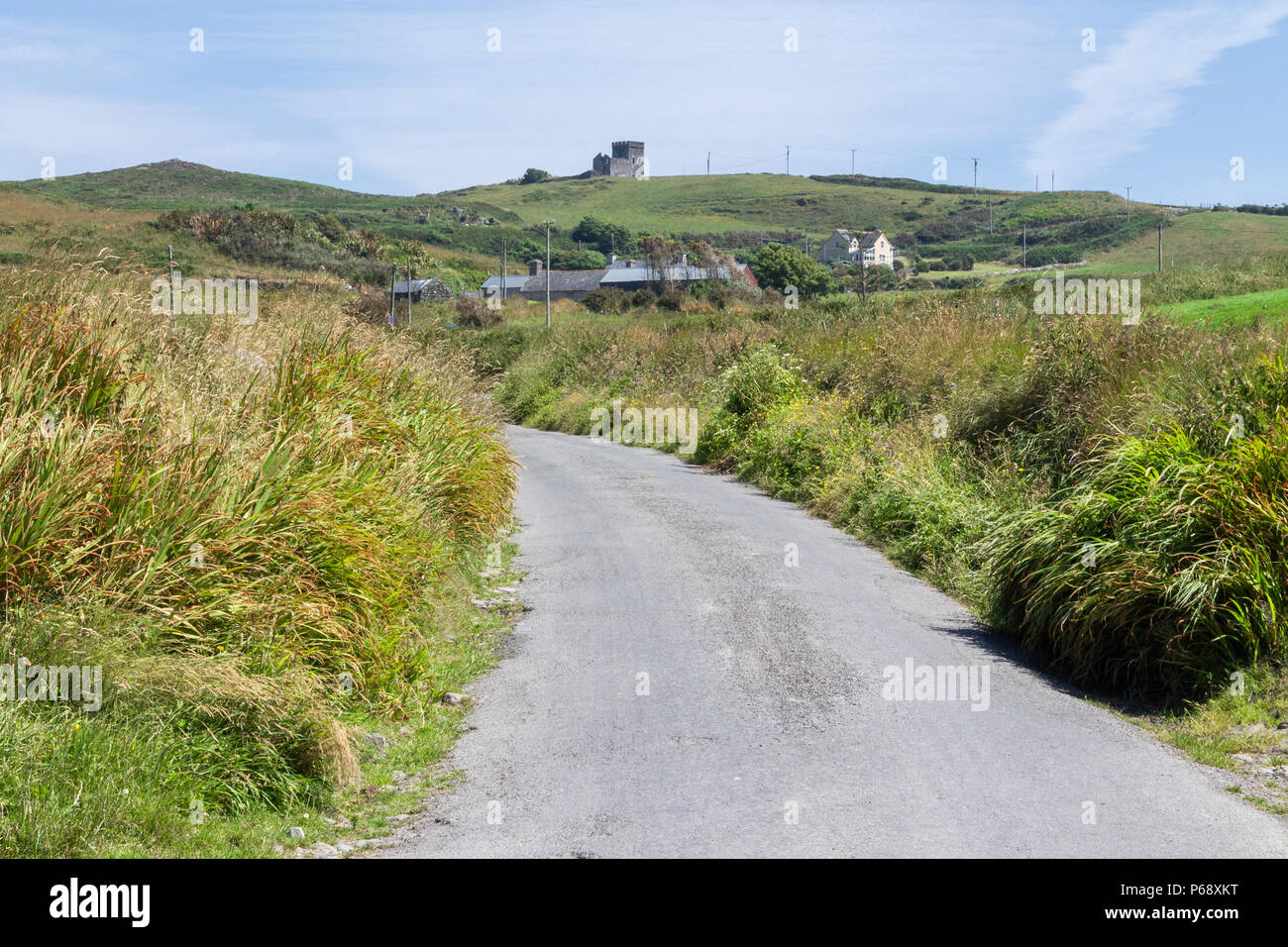 road leading up to Toe Head watch tower on the Horizon in west cork, Ireland. Stock Photo