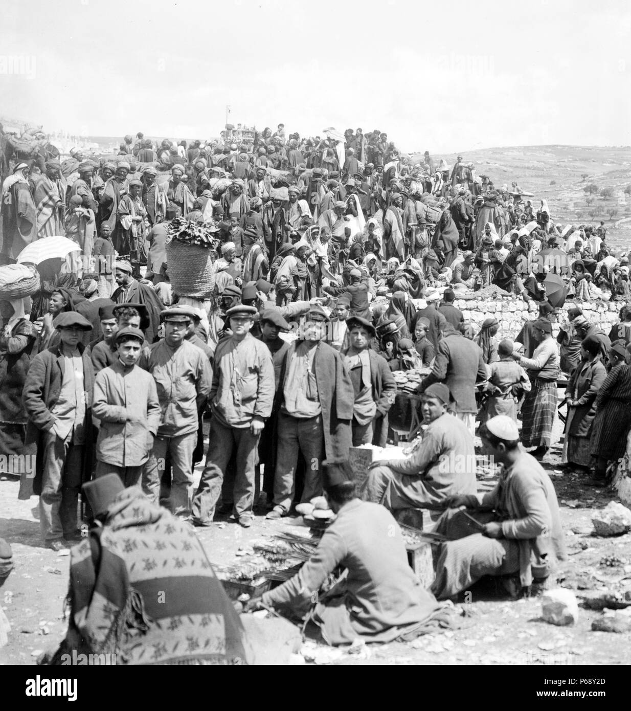Photograph of a crowd of people at a market, in British ruled Palestine. Dated 1925 Stock Photo