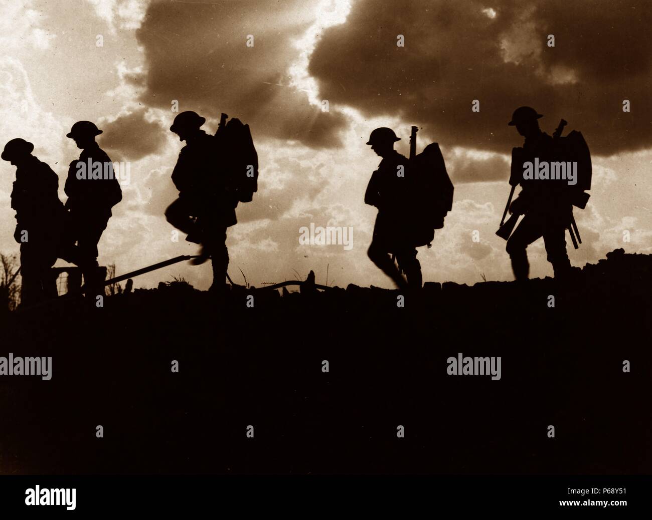 Photograph of Five Soldiers silhouetted against the sky at the Battle of Broodseinde. The Battle of Broodseinde was fought near Ypres in Flanders, at the east end of the Gheluvelt plateau, by the British Second and Fifth armies and the German Fourth Army. The Battle was the most successful Allied attack of the Battle of Passchendaele. Dated 1917 Stock Photo