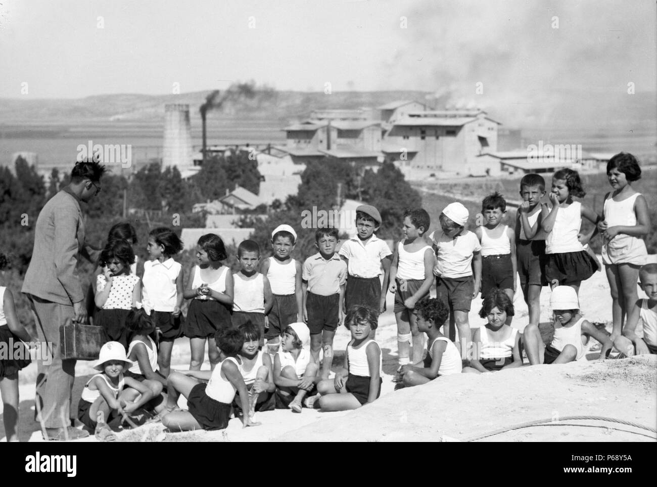 Photograph of Jewish School children on Carmel slope in the background the Nesher, Haifa. Dated 1936 Stock Photo