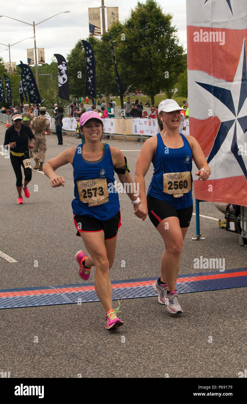Rebecca Kurz (left) and Elizabeth Macdonald cross the finish line after