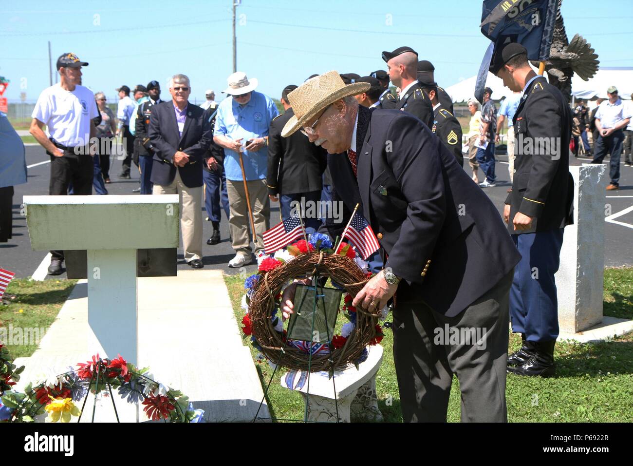 Alfred May places a wreath by the Alpha Company, 1st Battalion, 506th Infantry Regiment, 1st Brigade Combat Team, 101st Airborne Division (Air Assault) memorial to honor his fallen brothers-in-arms during his time in Vietnam on May 13, 2016. May, who attended the 1st Bn. 506th Inf Regt. Distinguished and Honorary Member of the Regiment induction ceremony, was one of the original members that helped to create the first memorial in Camp Evans, Vietnam in 1971 and the recreated memorial that stands in Fort Campbell today. (U.S. Army photo by Staff Sgt. Jesse Anderla, 1st Brigade Combat Team, 101s Stock Photo