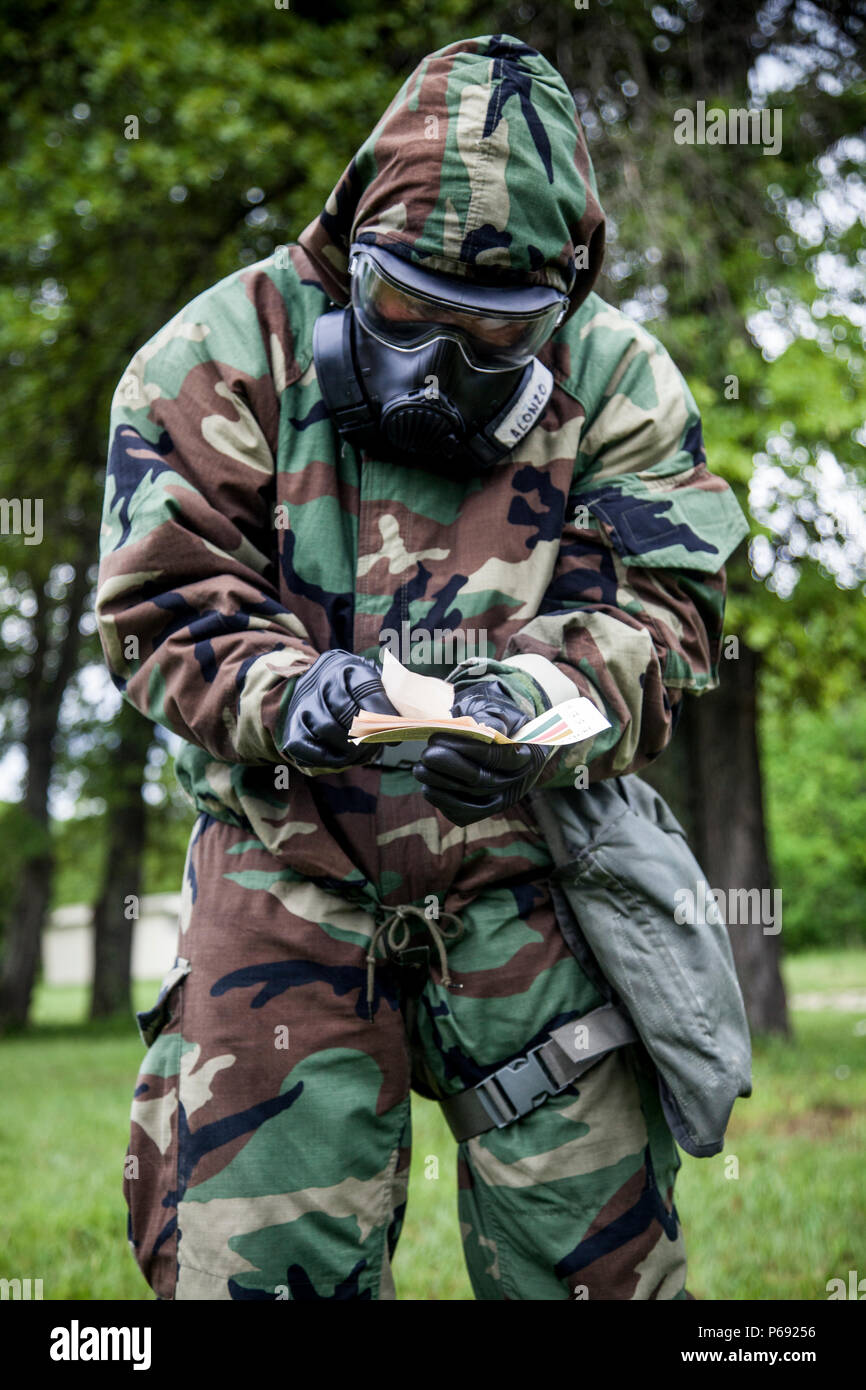 A U.S. Marine assigned to Chemical Biological Radiological and Nuclear  (CBRN) Defense School, conducts a contamination test during a field  training exercise at Fort Leonard Wood, M.O., May 11, 2016. CBRN training