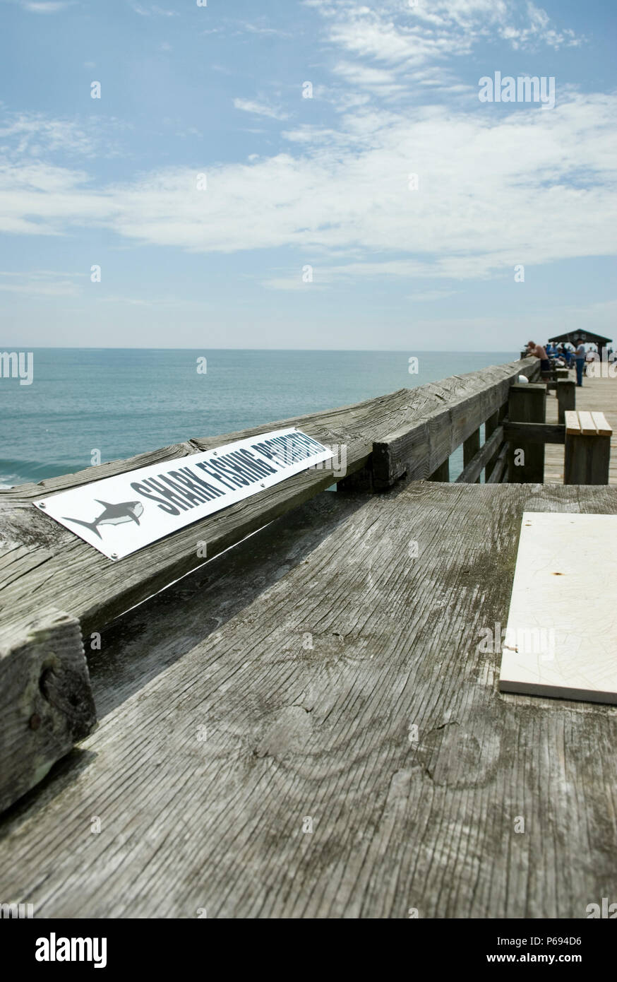 No shark fishing sign on pier at Myrtle Beach State Park, SC, USA. Stock Photo