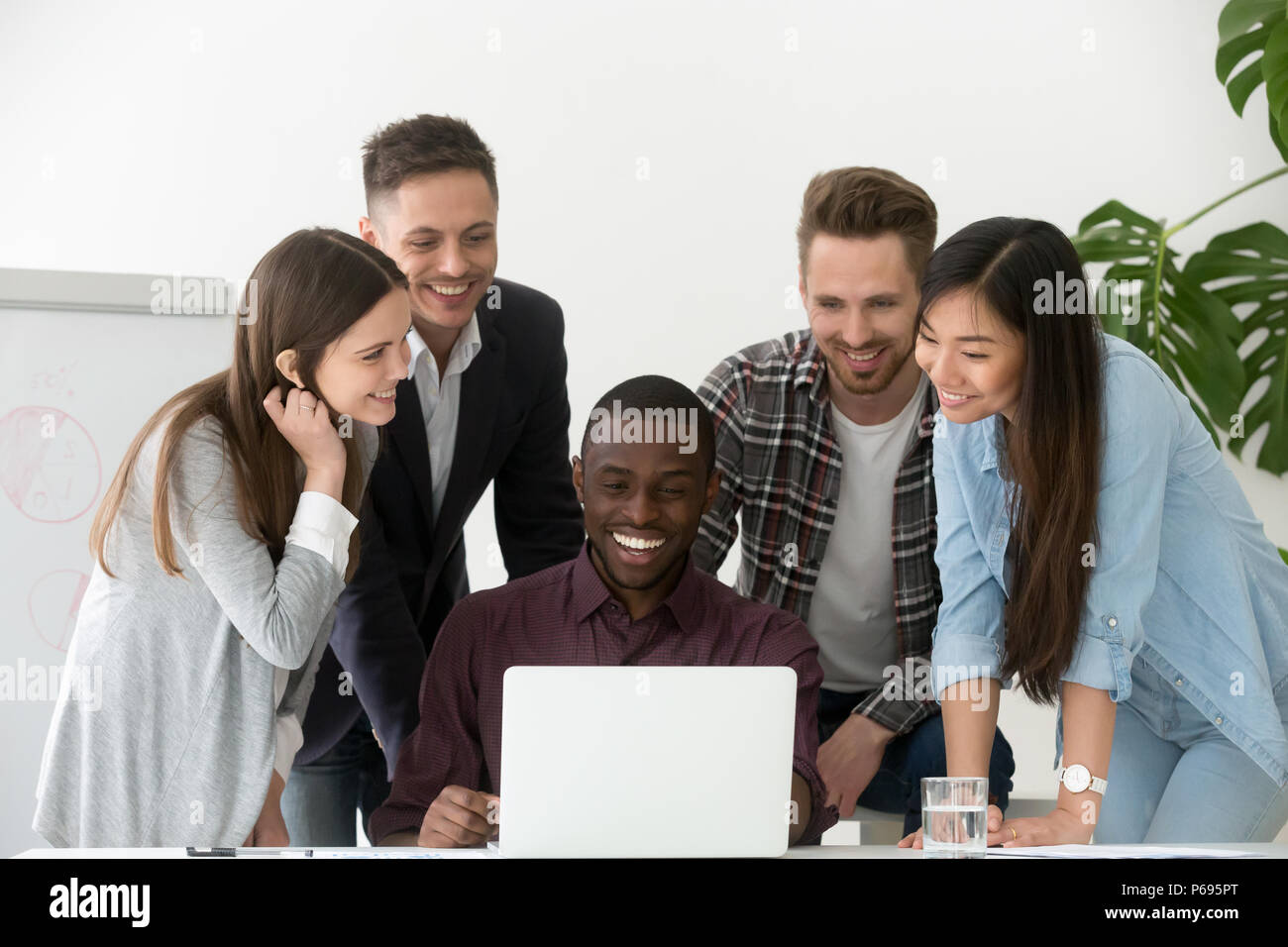 Smiling work team excited by company business success on market Stock Photo