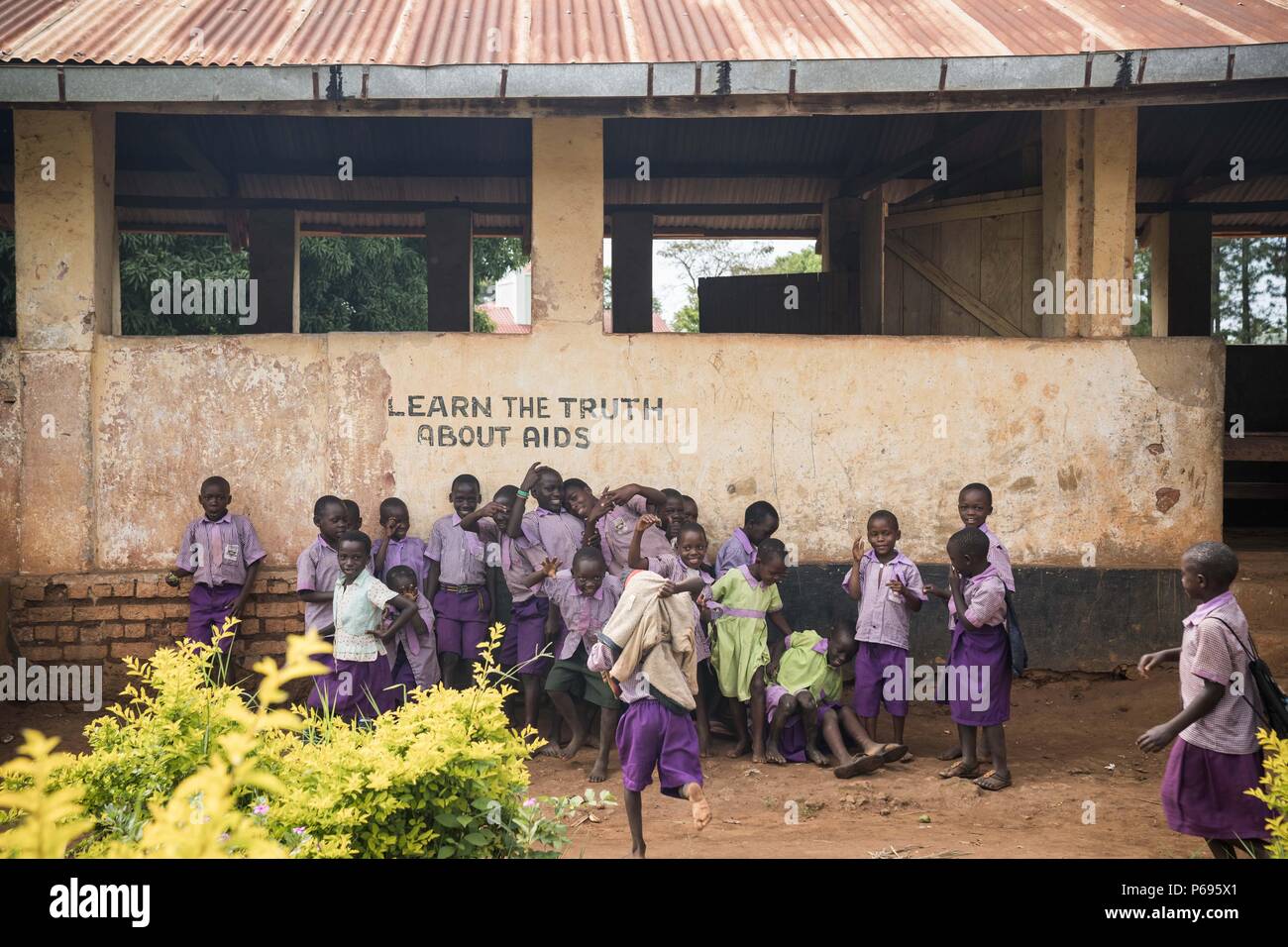 Pupils seen playing next to a class room. Primary school students on their last day of term in a local school near the town of Hoima in western Uganda. Stock Photo