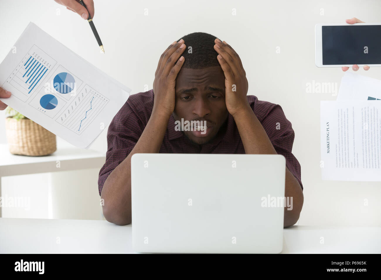 Stressed worker tired by too much work and annoying clients Stock Photo ...