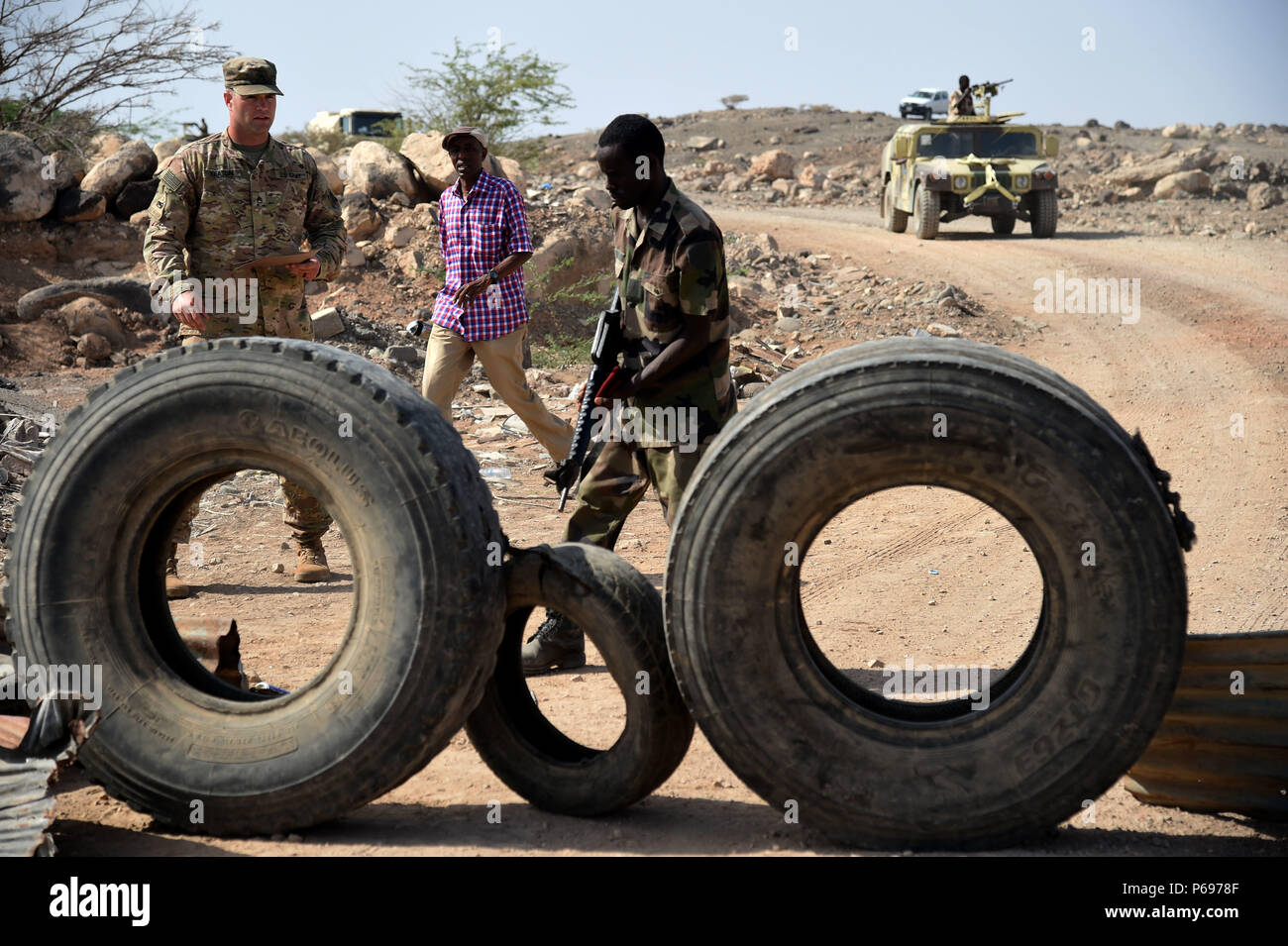 CAMP CHEIK OSMAN, Djibouti – U.S. Army Staff Sgt. Richard Keaton, U.S. Army  Regionally Aligned Forces instructor, tests a Djiboutian Armed Forces (FAD)  soldier on identifying a mock roadside bomb during a