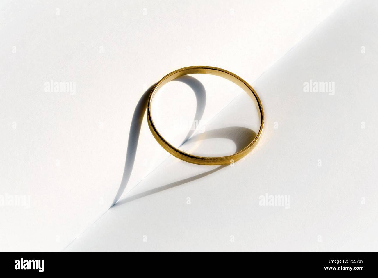Shadow of a wedding ring Stock Photo
