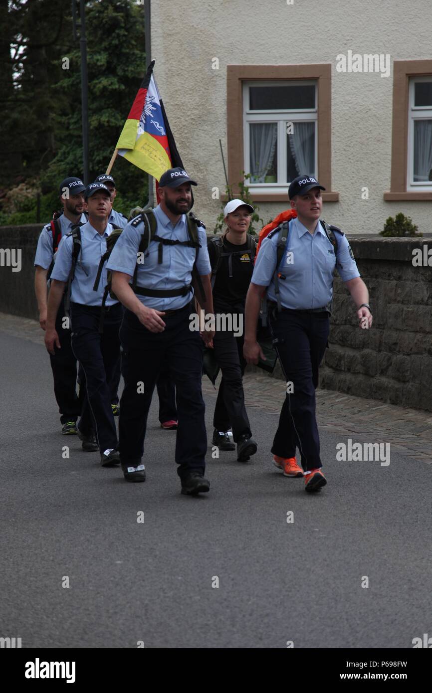 A team of Local Police Officers approach a checkpoint during the 49th  Annual Marche Internationale de Diekirch, Diekirch, Luxembourg, May 22,  2016. This is an annual international marching event hosted by the