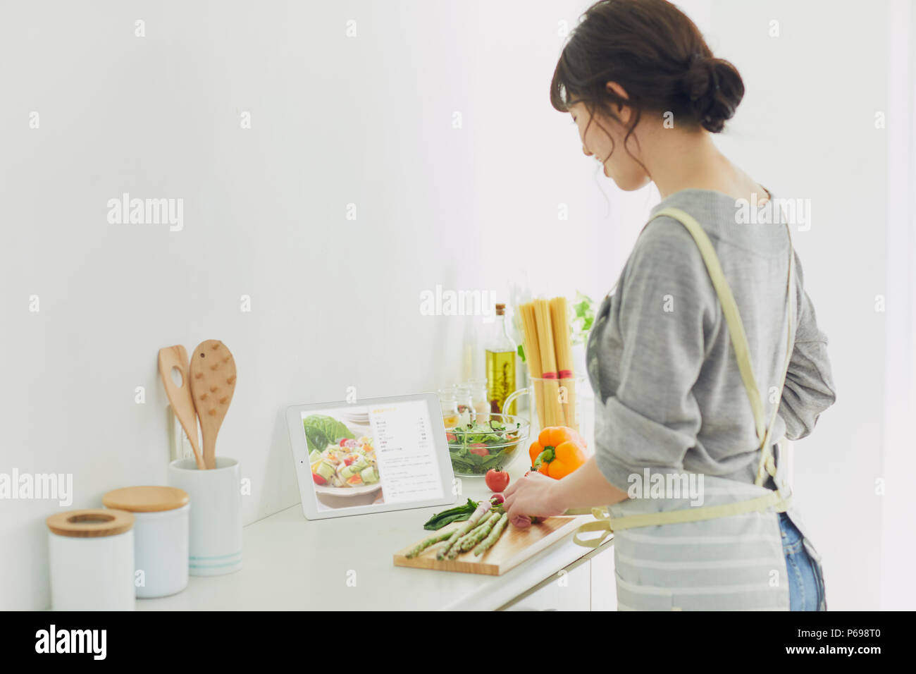 Japanese housewife in the kitchen Stock Photo pic picture