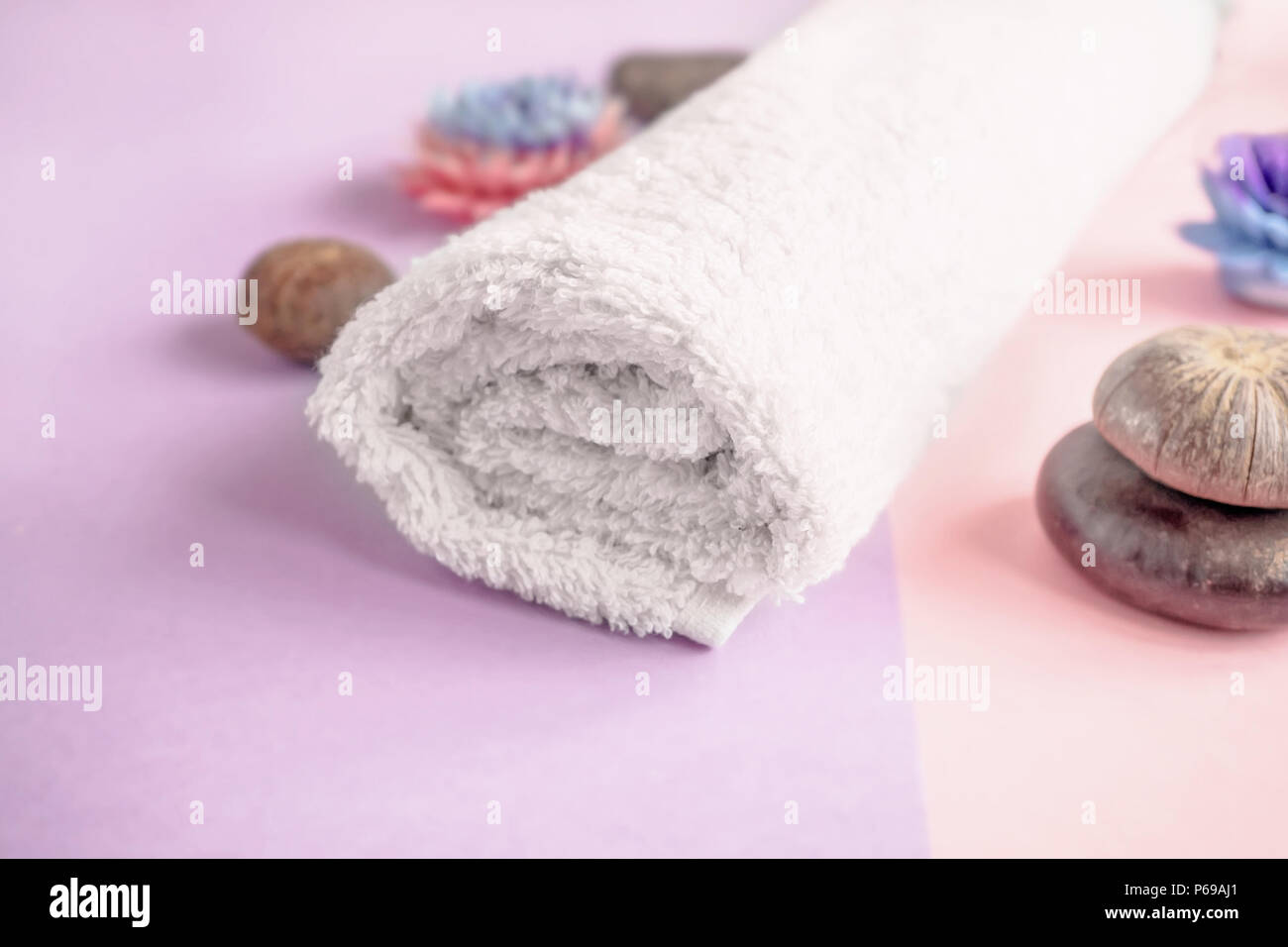 Beautiful soap in the form of flowers and towel with lavender flowers for Spa treatments on a two-tone background. Selective focus. The horizontal fra Stock Photo