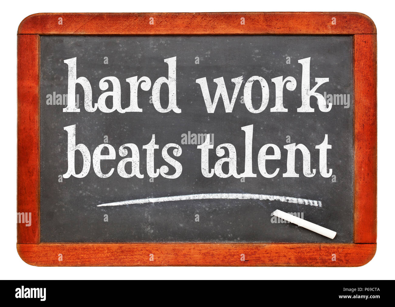 Hard work beats talent - white chalk text on a vintage slate blackboard Stock Photo