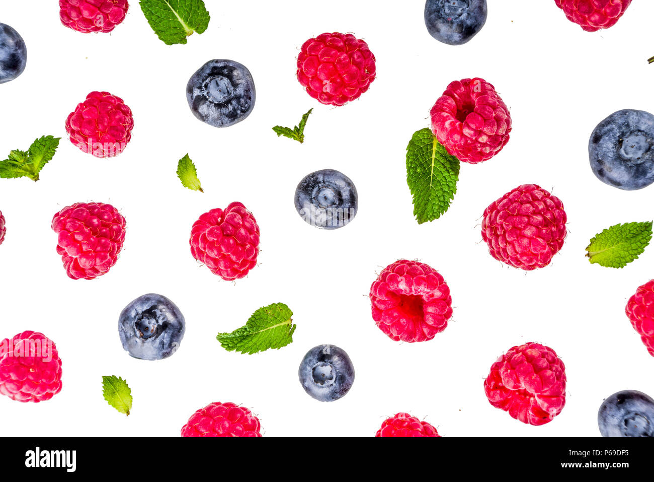 Creative layout with raspberry and blueberry with waffle ice cream cones, simple pattern above copy space Stock Photo