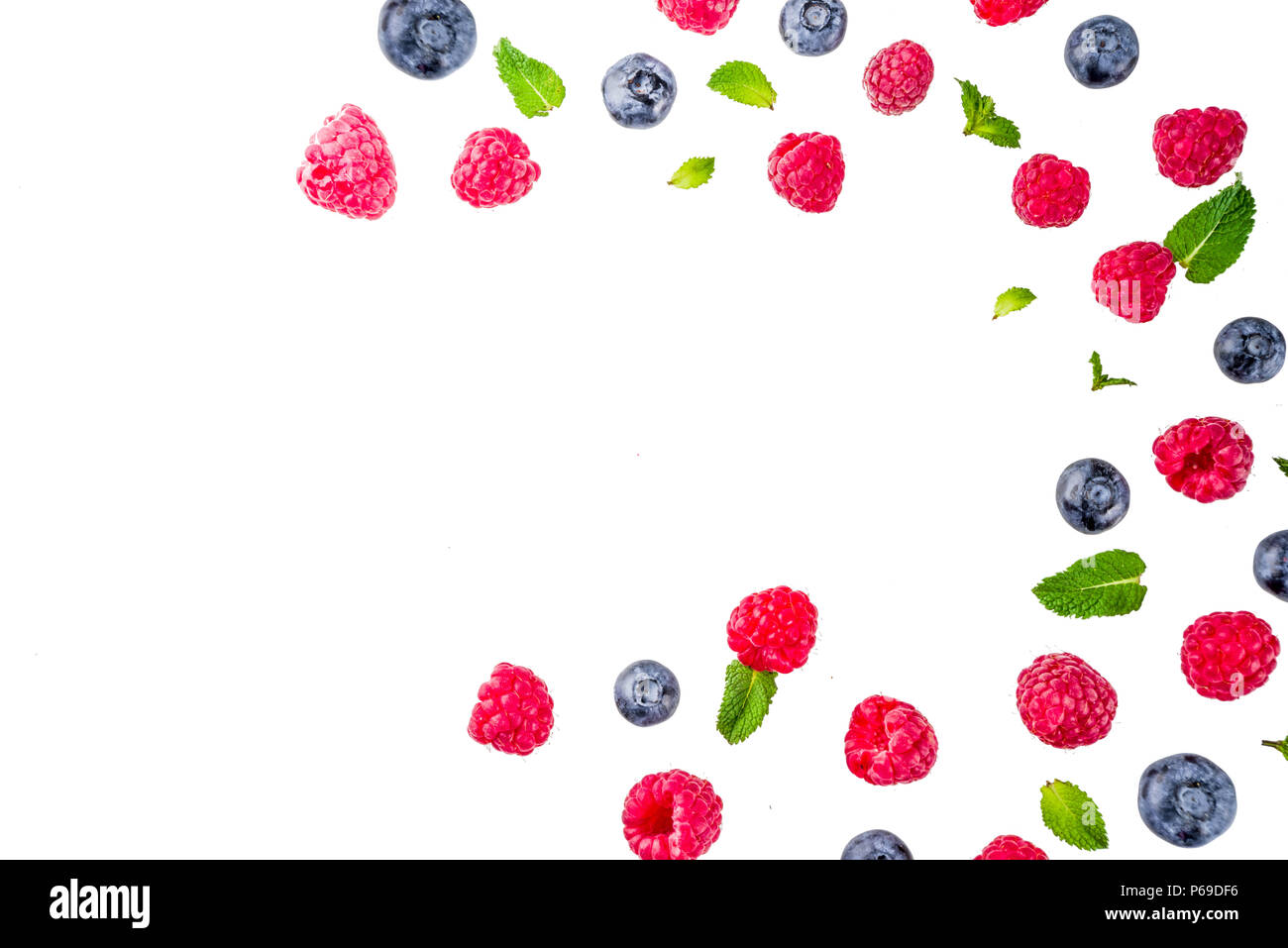 Creative layout with raspberry and blueberry with waffle ice cream cones, simple pattern above copy space Stock Photo
