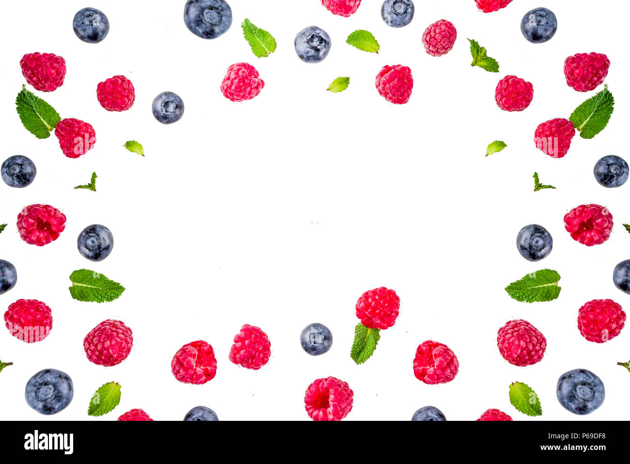 Creative layout with raspberry and blueberry with waffle ice cream cones, simple pattern above copy space Stock Photo