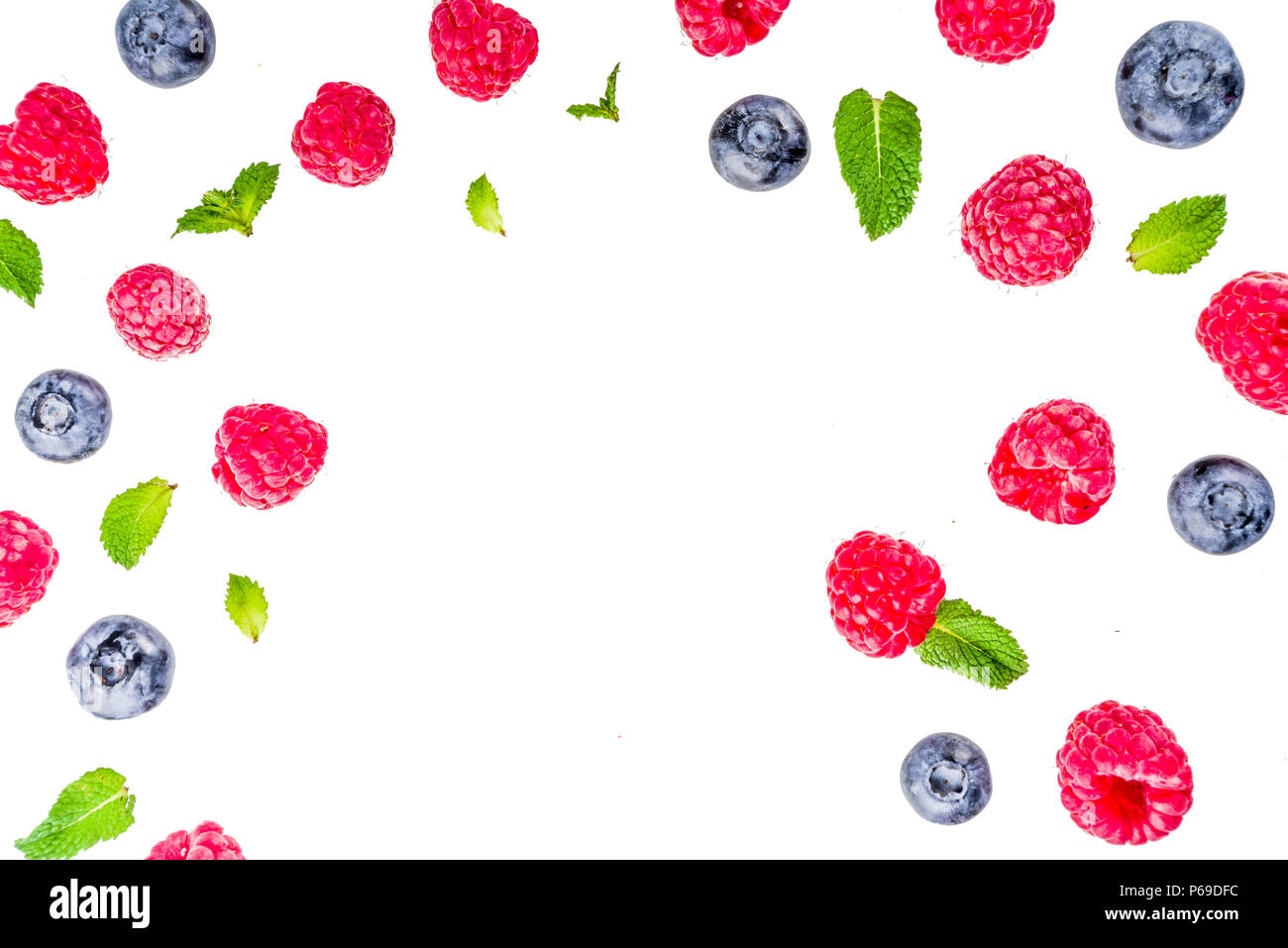 Creative layout with raspberry and blueberry with waffle ice cream cones, simple pattern above copy space Stock Photo