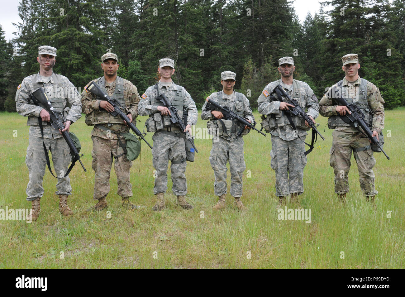 Noncommissioned officers and Soldiers stand together after completing ...