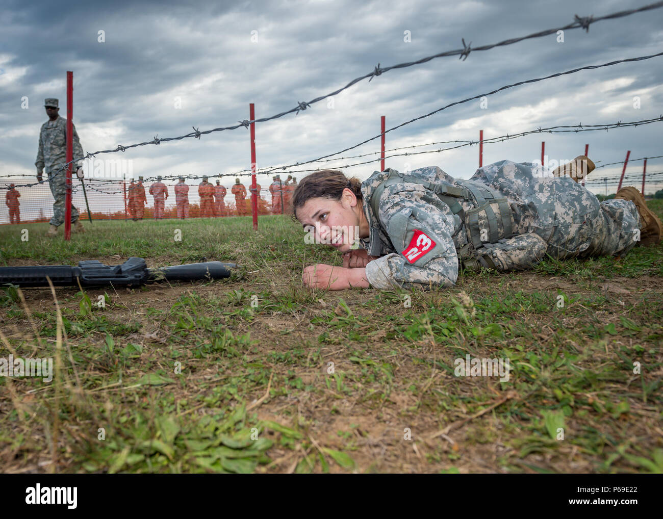 2nd Lt. Leah Mullenix, Team 23, 326th Brigade Engineer Battalion, 1st Brigade Combat Team, 101st Airborne Division (Air Assault), crawls under barbed wire with her individual assigned weapon during a low crawl event of the “x-mile” portion of the Best Sapper Competition at Fort Leonard Wood, Mo., April 21, 2016. The x-mile was the final phase of the three-day competition in which competitors had to complete a series of tasks in the quickest time possible. Mullenix was the first female, Army-wide, to complete the three-day competition and place in the top ten teams. (U.S. Army photo courtesy of Stock Photo