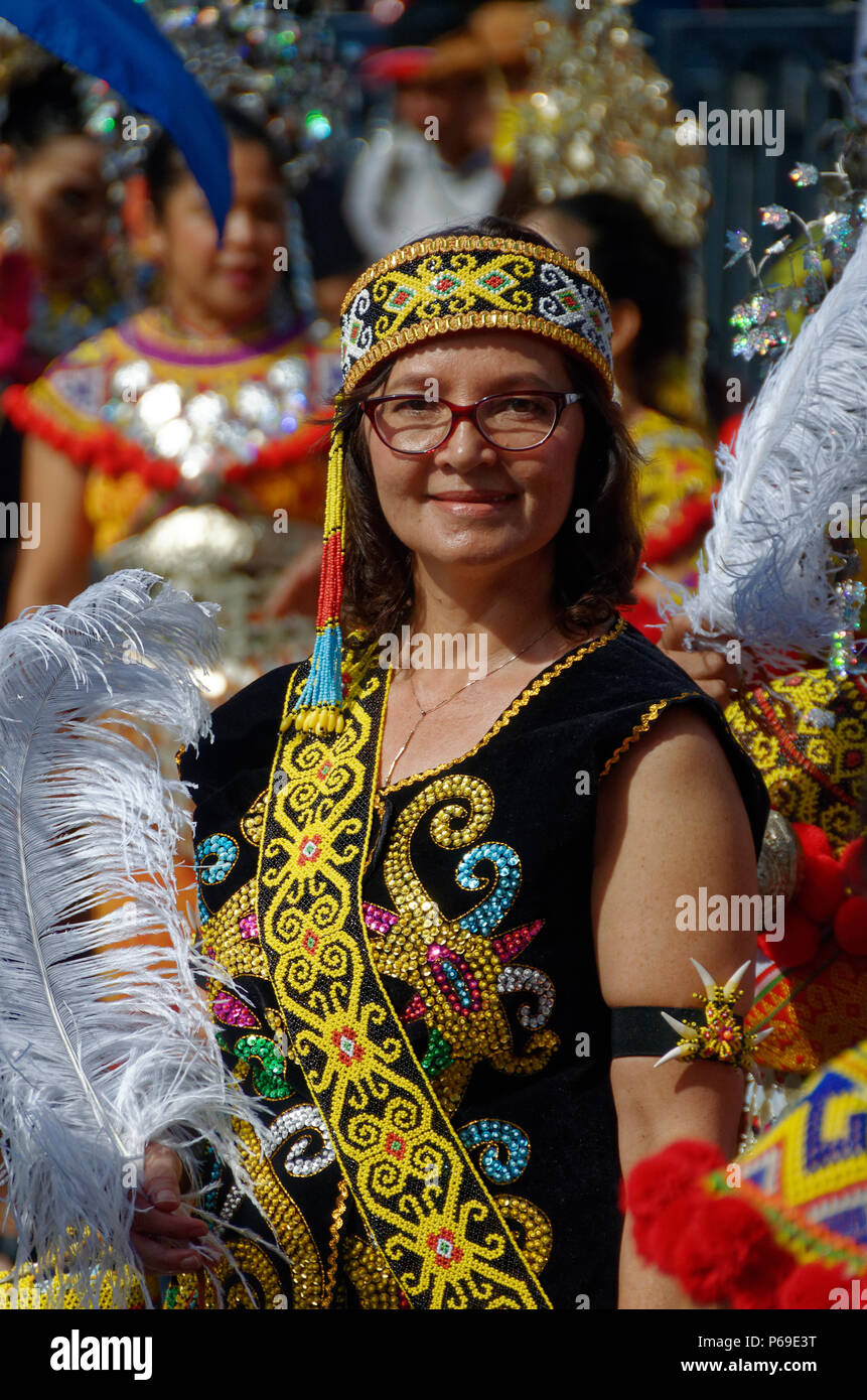 dayak woman in traditional costume, and spectacles, smiling, Gawai parade, Kuching, Sarawak, Malaysia, Borneo Stock Photo