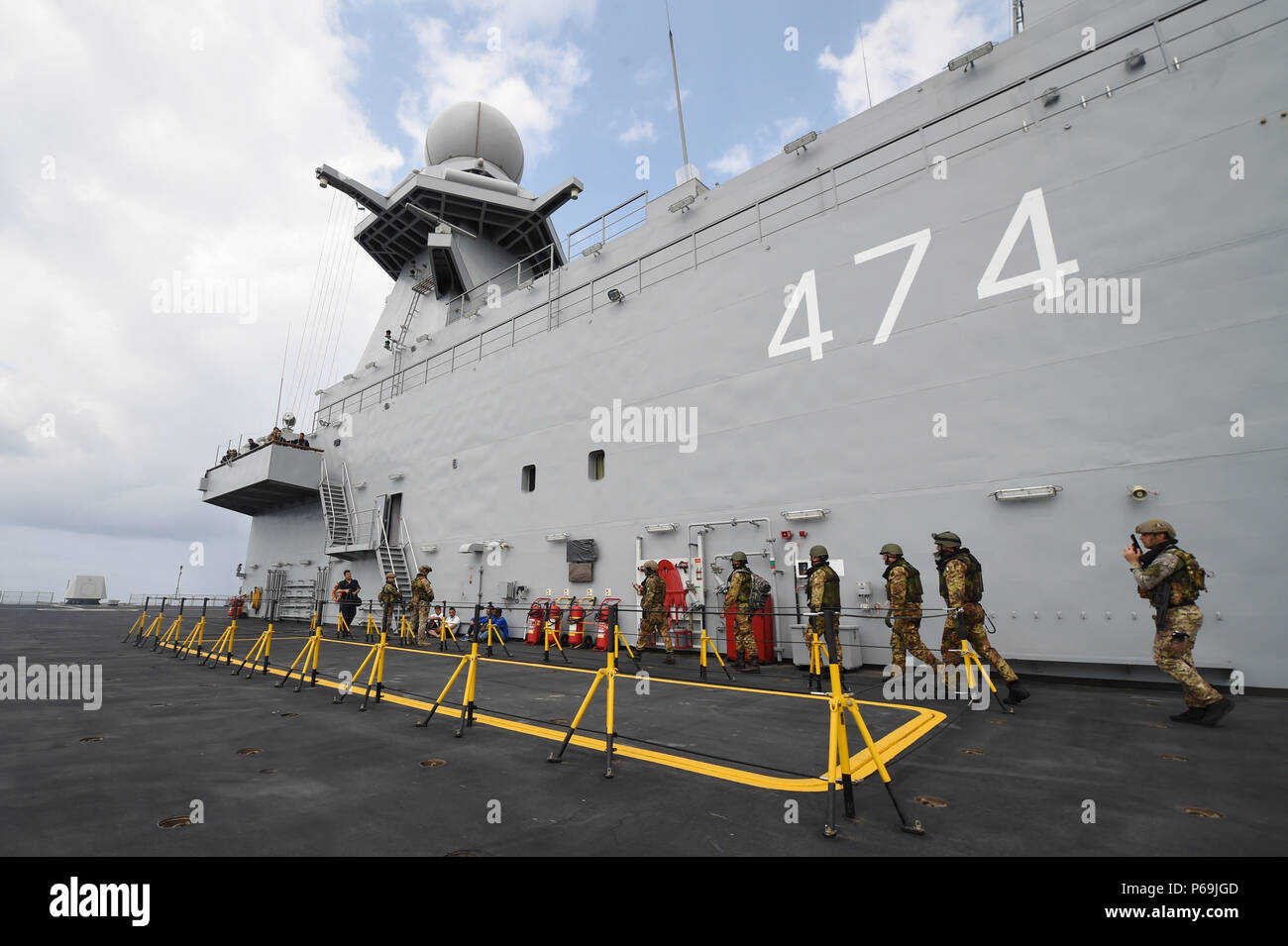 160522-n-xt273-586-mediterranean-sea-may-22-2016-italian-sailors-and-marines-participate-in-a-mock-visit-board-search-and-seizure-boarding-drill-aboard-the-algerian-ship-kalaat-beni-abbes-474-during-exercise-phoenix-express-2016-may-22-phoenix-express-is-a-us-africa-command-sponsored-multinational-maritime-exercise-designed-to-increase-maritime-safety-and-security-in-the-mediterranean-us-navy-photo-by-mass-communication-specialist-2nd-class-justin-stumbergreleased-P69JGD.jpg