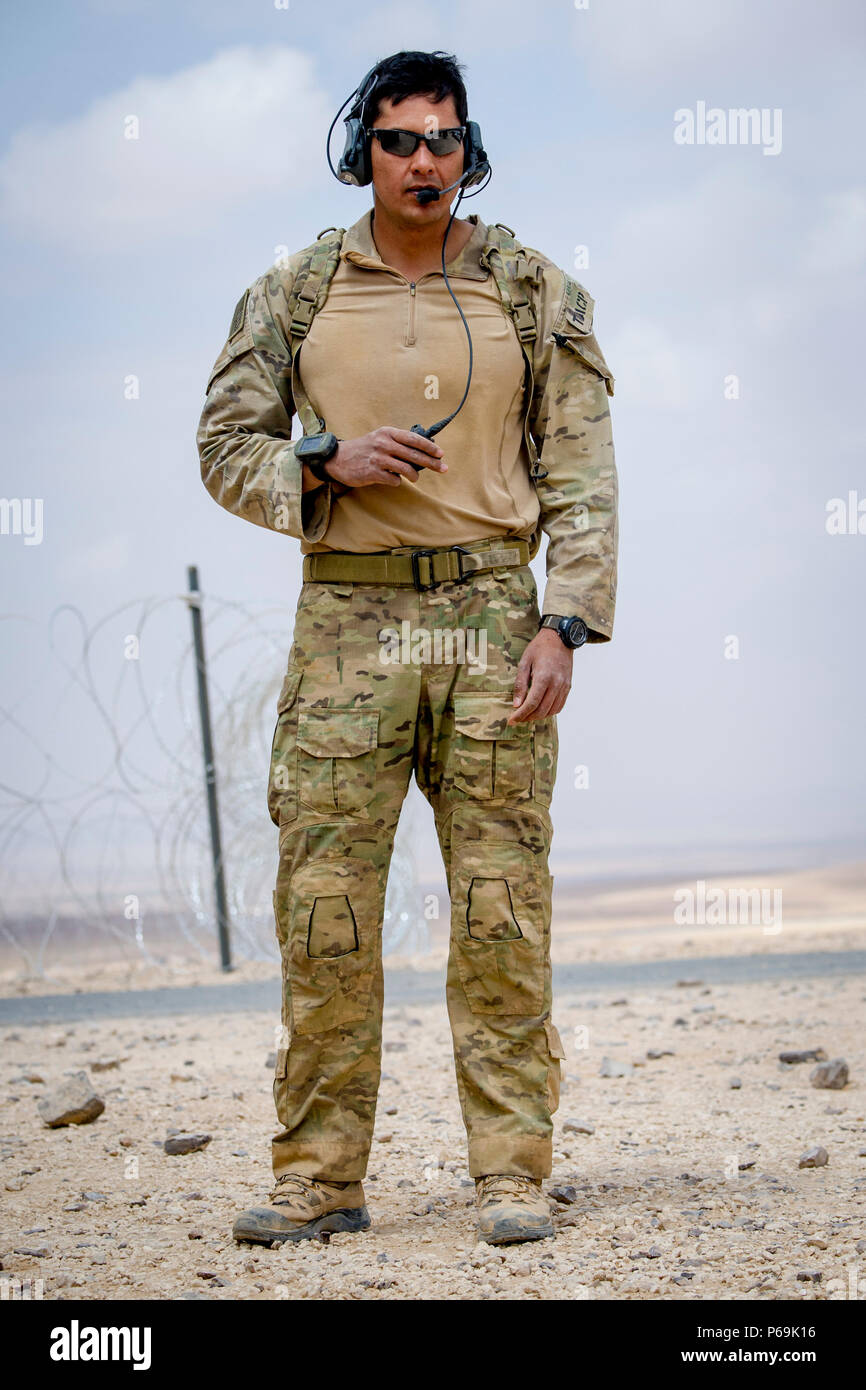 A U.S. Air Force Tactical Air Control Party (TACP) Airman communicates with  U.S. Air Force B-52 Bombers and F-16 fighter jets as they approach Al  Zarqa, Jordan, for a show-of-force demonstration during