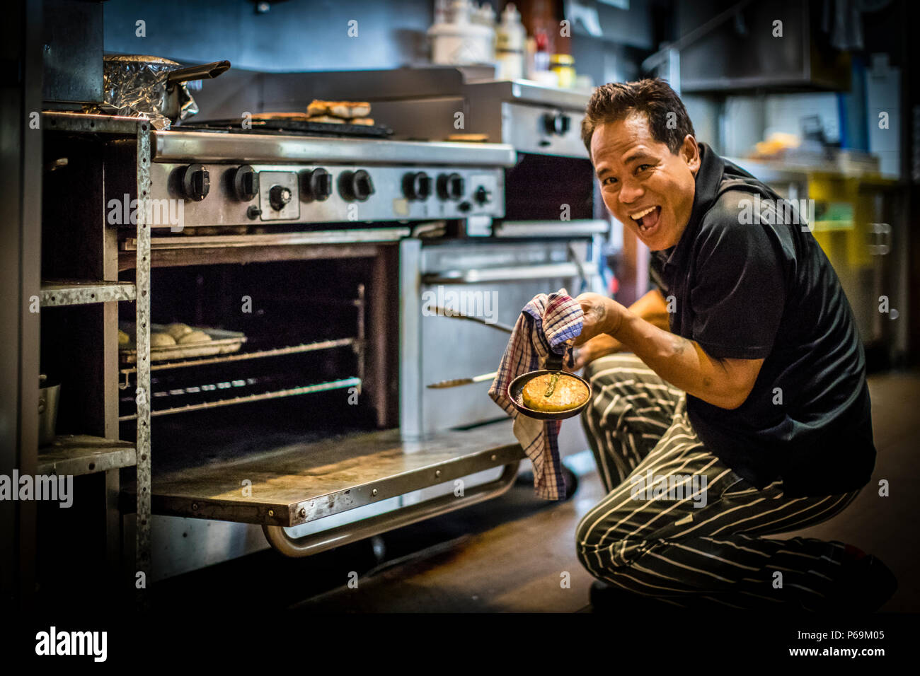 Executive chef of Bamurru Plains Lodge, Northern Territory, Australia. The good-humored chef is called Madé, originates from Bali and has been the head chef at Bamuru Plains Lodge for years, and for many of the well-heeled guests a good reason to come here. Some have already booked him for their own festivities. Stock Photo