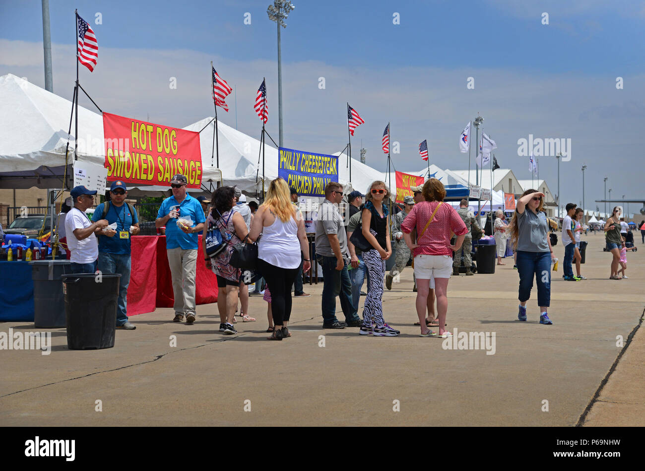 Dozens walk the length of the flightline concession area during the