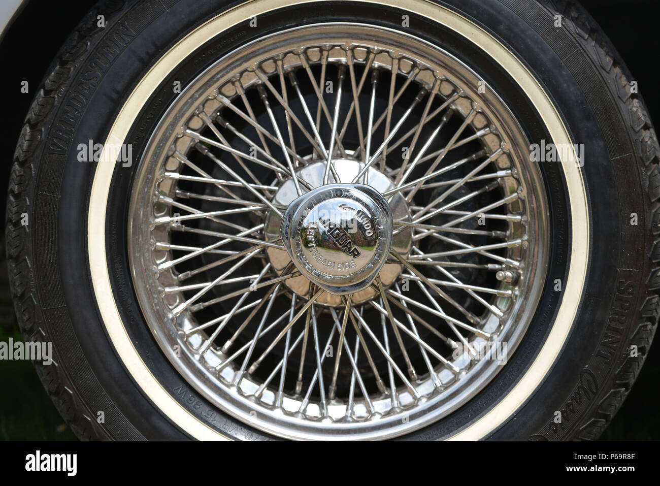 Classic E-type Jaguar wire spoke wheel. Stock Photo