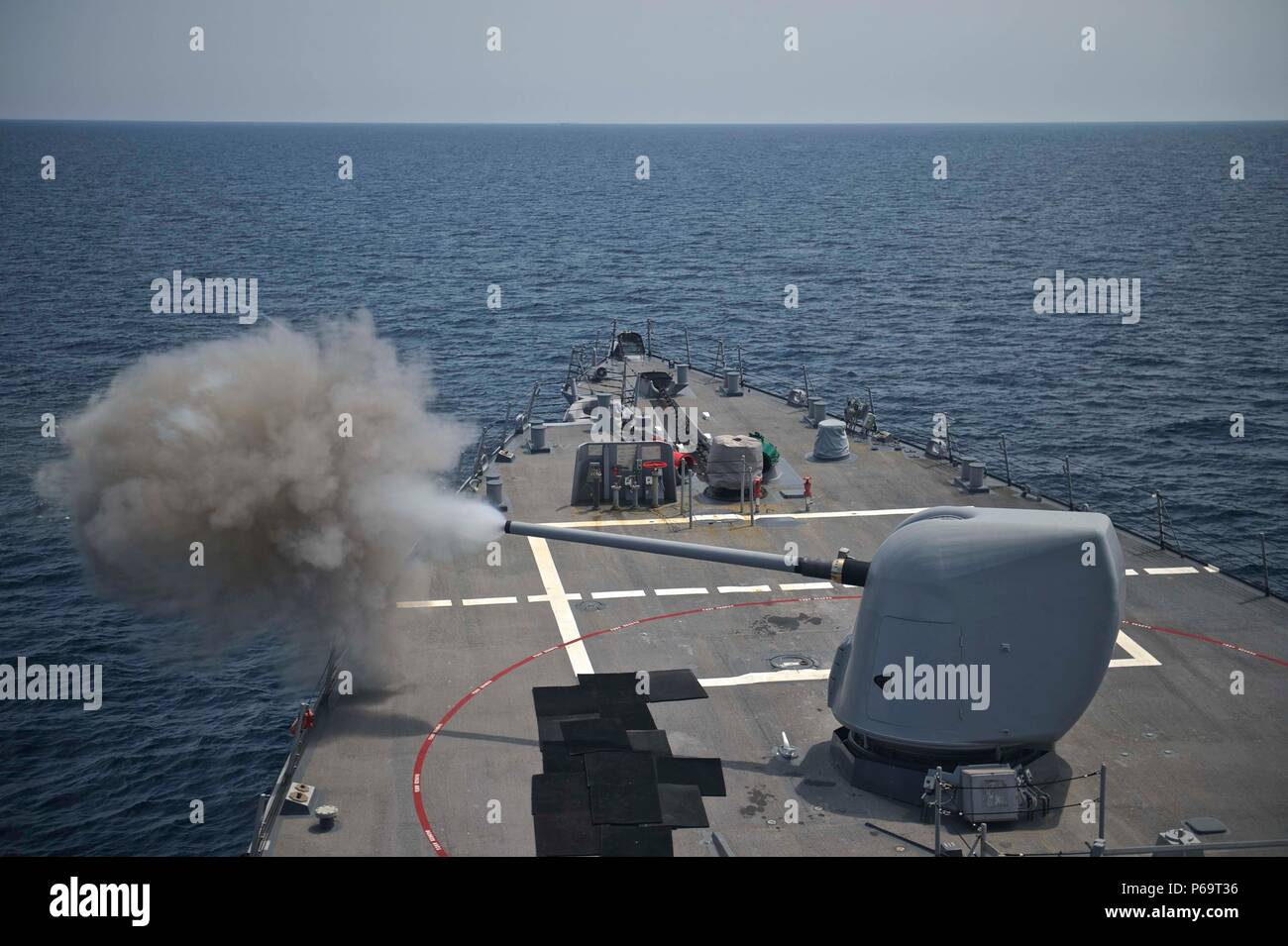 160521-N-QC631-234 WATERS SURROUNDING THE KOREAN PENINSULA (May 21, 2016) A MK 45 5 inch gun is fired during gunnery exercises aboard the guided-missile destroyer USS Decatur (DDG 73). Decatur, along with USS Momsen (DDG 92) and USS Spruance (DDG 111), with embarked “Devil Fish” and “Warbirds” detachments of Helicopter Maritime Strike Squadron (HSM) 49, are deployed as part of a U.S. 3rd Fleet Pacific Surface Action Group (PAC SAG) under Destroyer Squadron (CDS) 31. (U.S. Navy photo by Mass Communication Specialist 3rd Class Gerald Dudley Reynolds/Released) Stock Photo