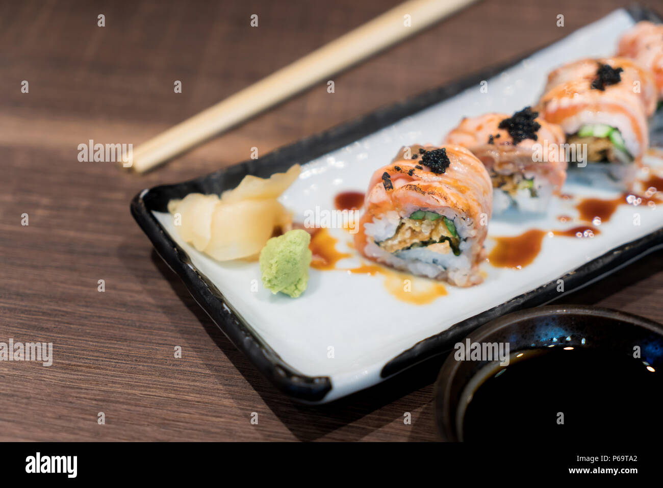 Philadelphia roll sushi with salmon, cucumber, avocado, cream cheese