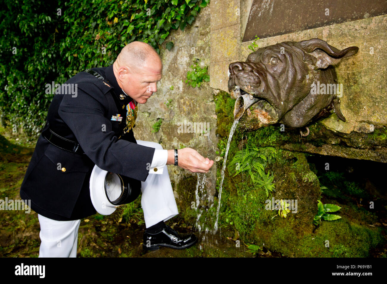 Commandant of the Marine Corps, Gen. Robert B. Neller, gets water from