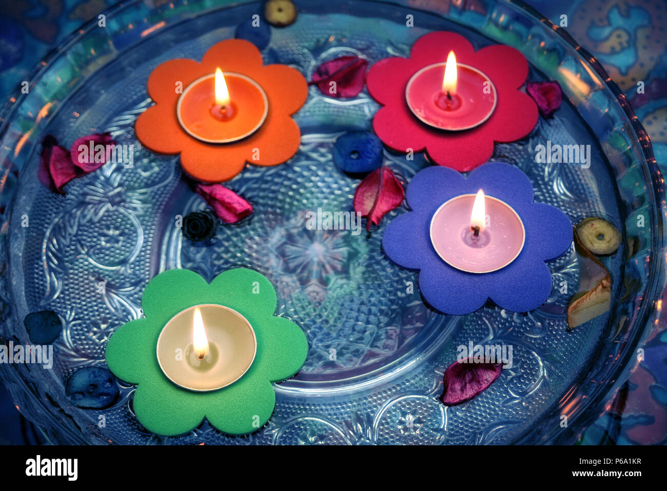 close up shot of floating candles in glass bowl Stock Photo Alamy